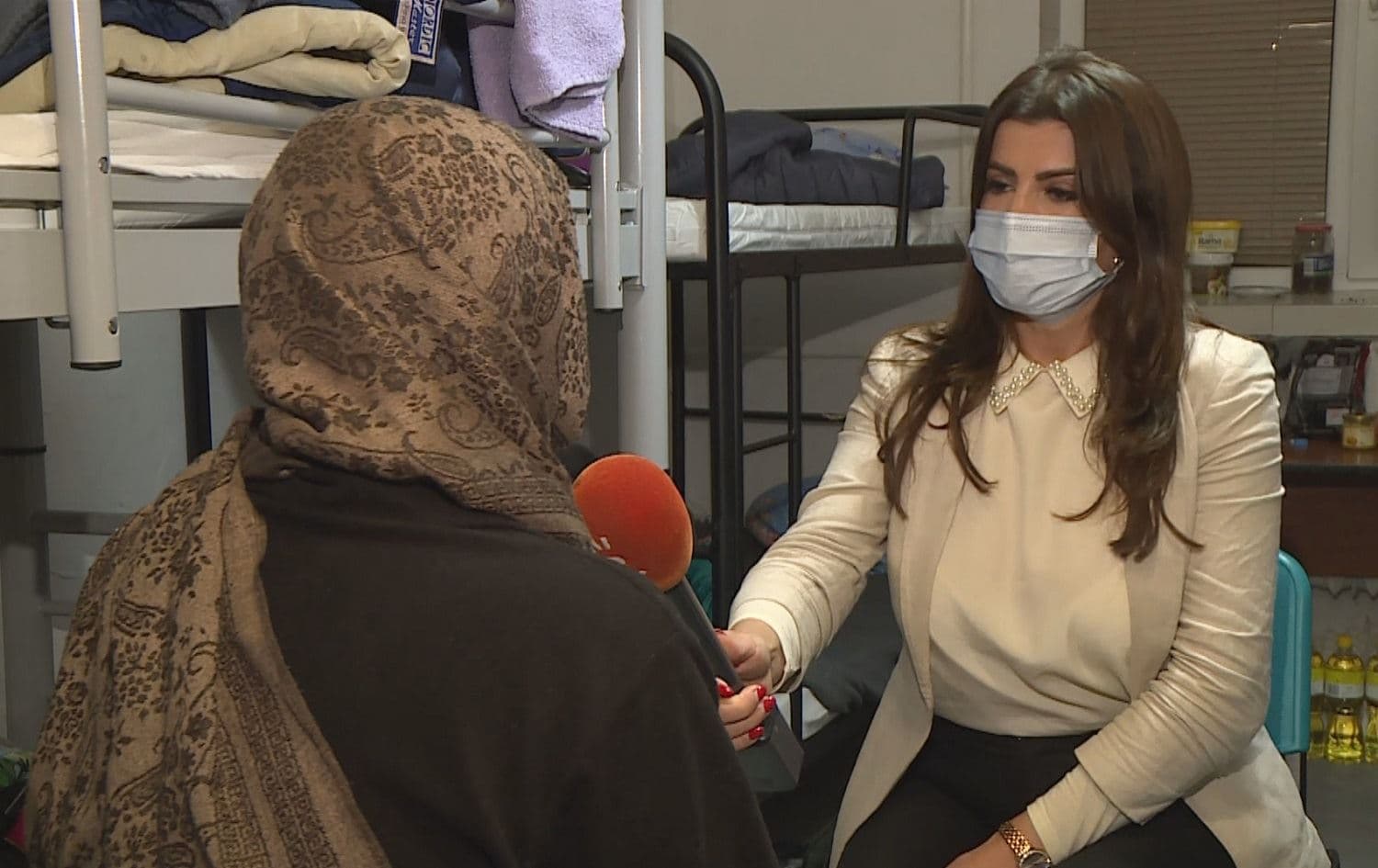 Iman Dler (left) requested her face not be shown in an interview with Rudaw’s Allah Shahly in Dabrowa Bialostocka, Poland on October 29, 2021. Photo: screengrab/Rudaw