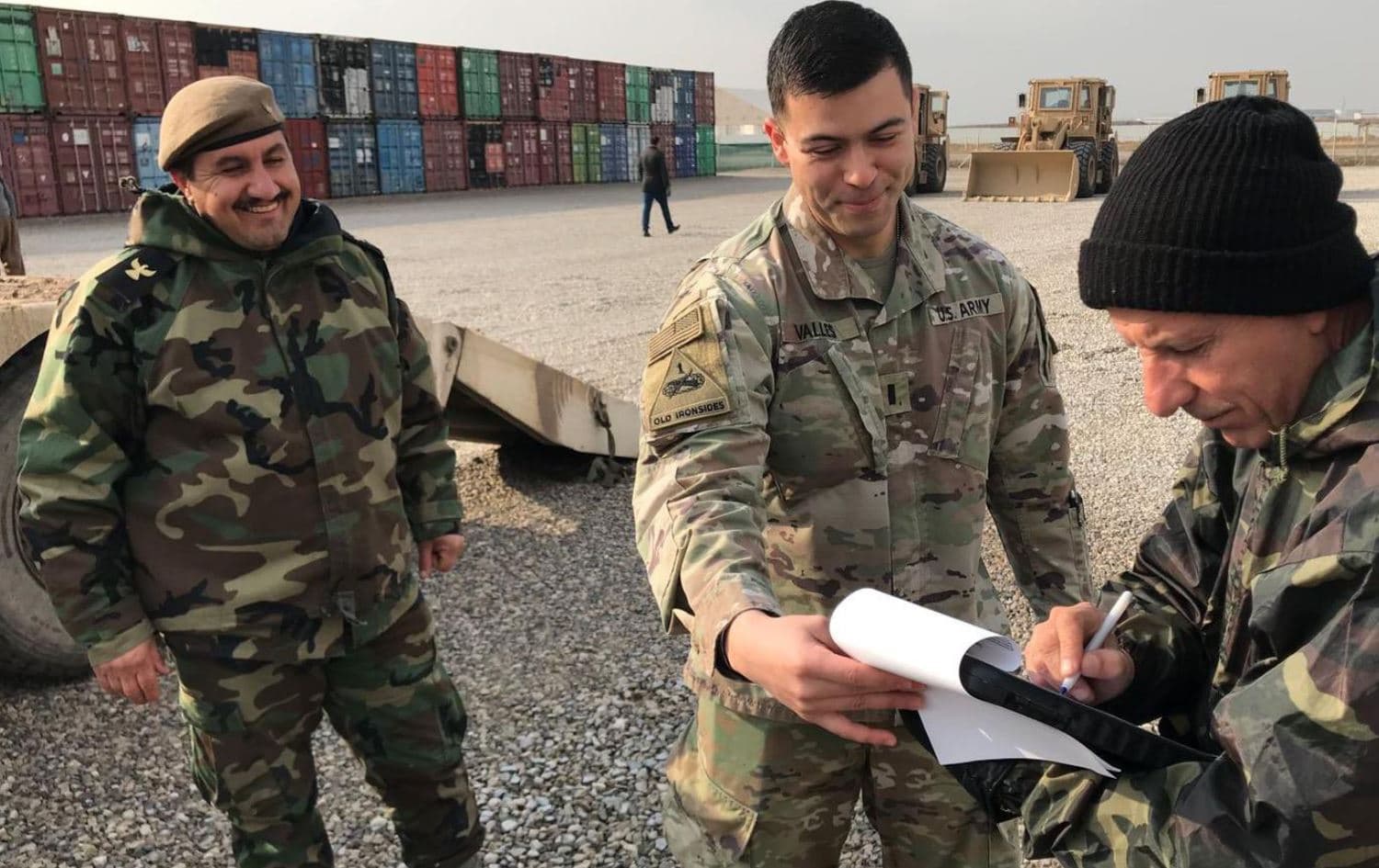 US army officer (middle) and Peshmerga forces during US divestment of weapons to the Peshmerga in January 2022. Photo: handout