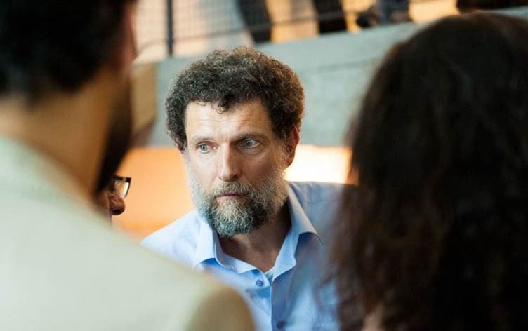Undated handout photograph released on October 15, 2021 by the Anadolu Culture Center shows Parisian-born Turkish philanthropist Osman Kavala speaking during an event in Istanbul. Photo: AFP/Anadolu Culture Center