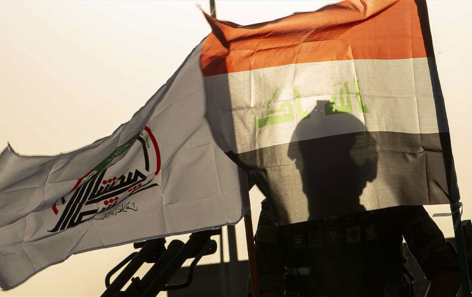 PMF members take part in a military parade in Basra, Iraq on June 14, 2020. Photo: Hussein Faleh/AFP