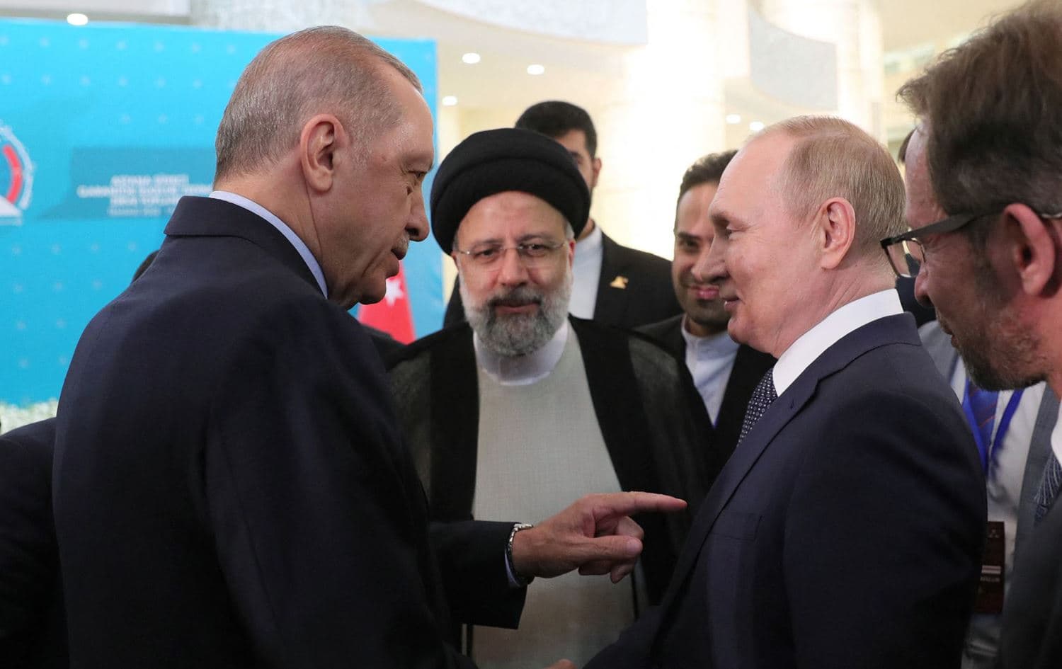 Turkish President Recep Tayyip Erdogan (left) speaking with Russian President Vladimir Putin (right) as Iranian President Ebrahim Raisi listens in Tehran on July 19, 2022. Photo: Turkish presidential press service/AFP