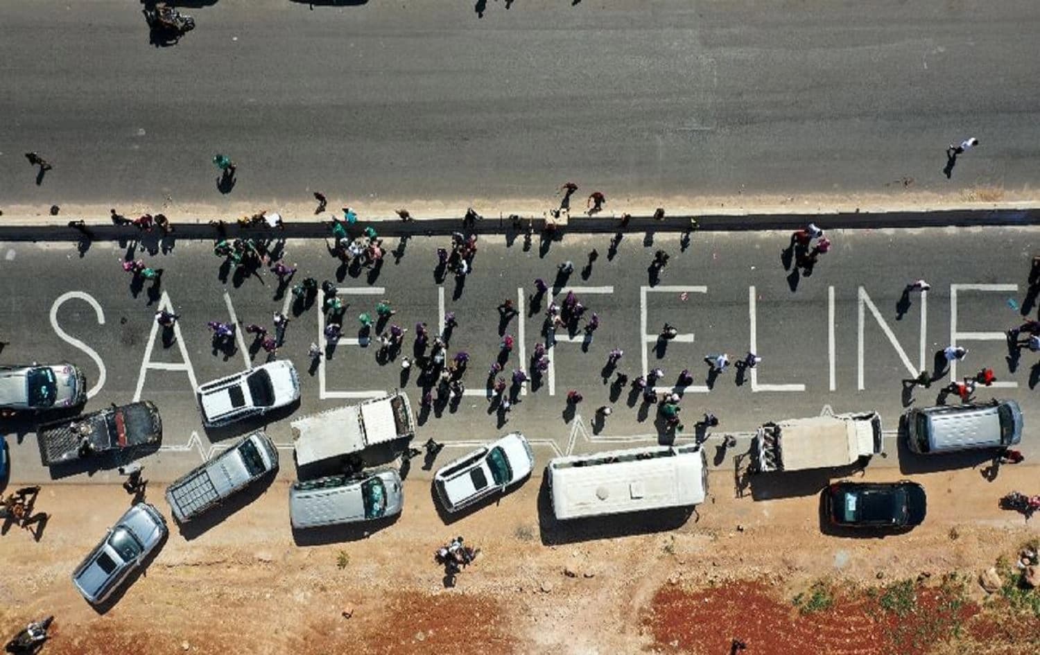 A human chain calling the continued passage of aid into Syria's rebel-held northwestern province of Idlib on July 2, 2021. File photo: AFP