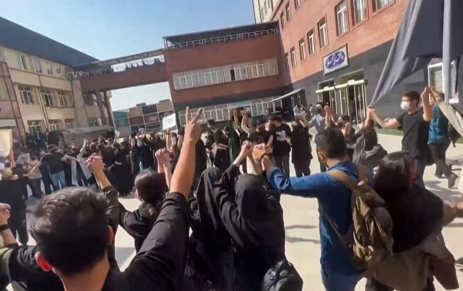 This image grab from a UGC video made available on October 15, 2022, shows Iranian students chanting "Freedom" as they rally at Tehran's University of Science and Culture. Photo: UGC/AFP