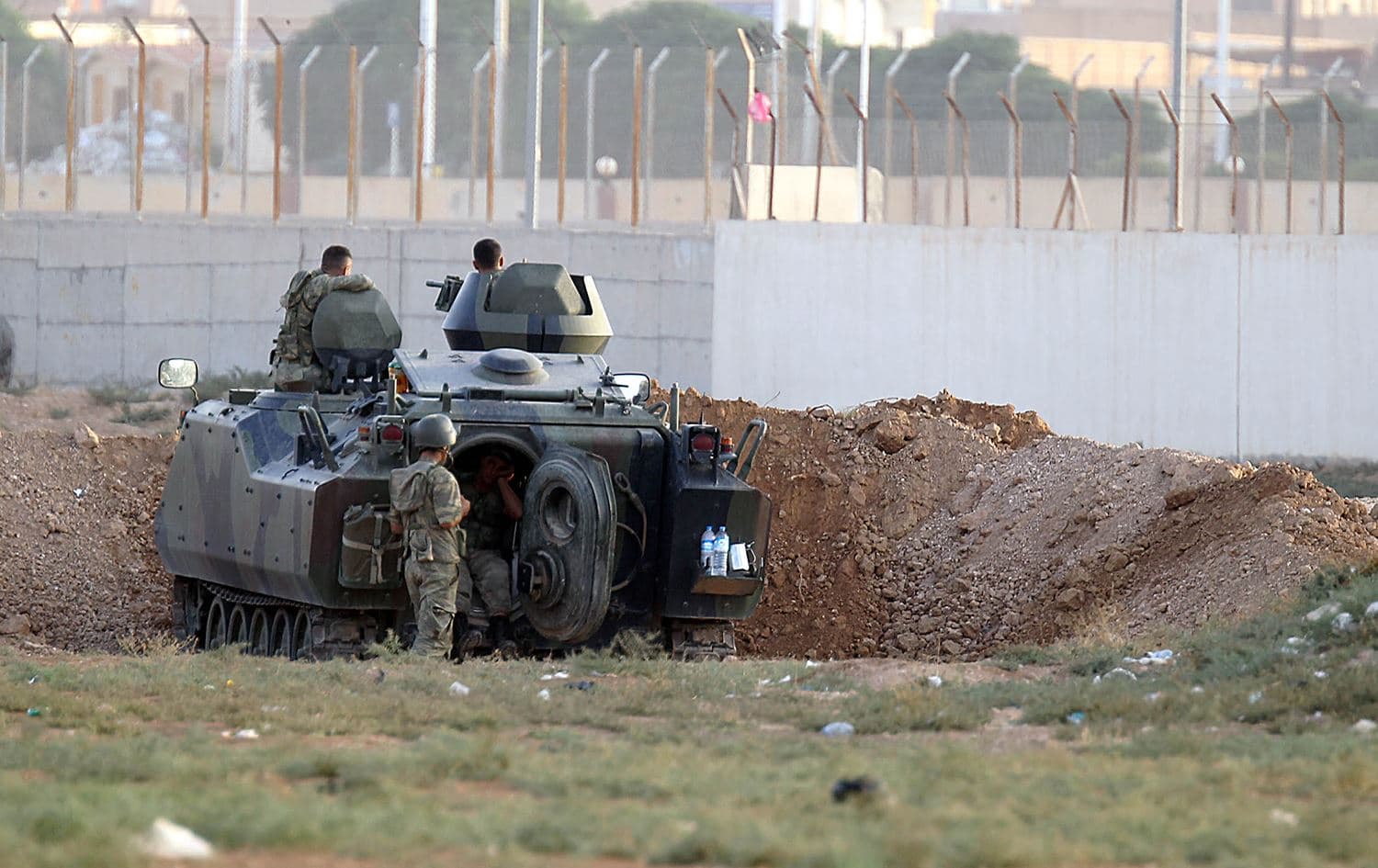 A Turkish army armoured personnel carrier is dug in on the border with Syria near Akcakale taken on October 7, 2012. File photo: STR/AFP