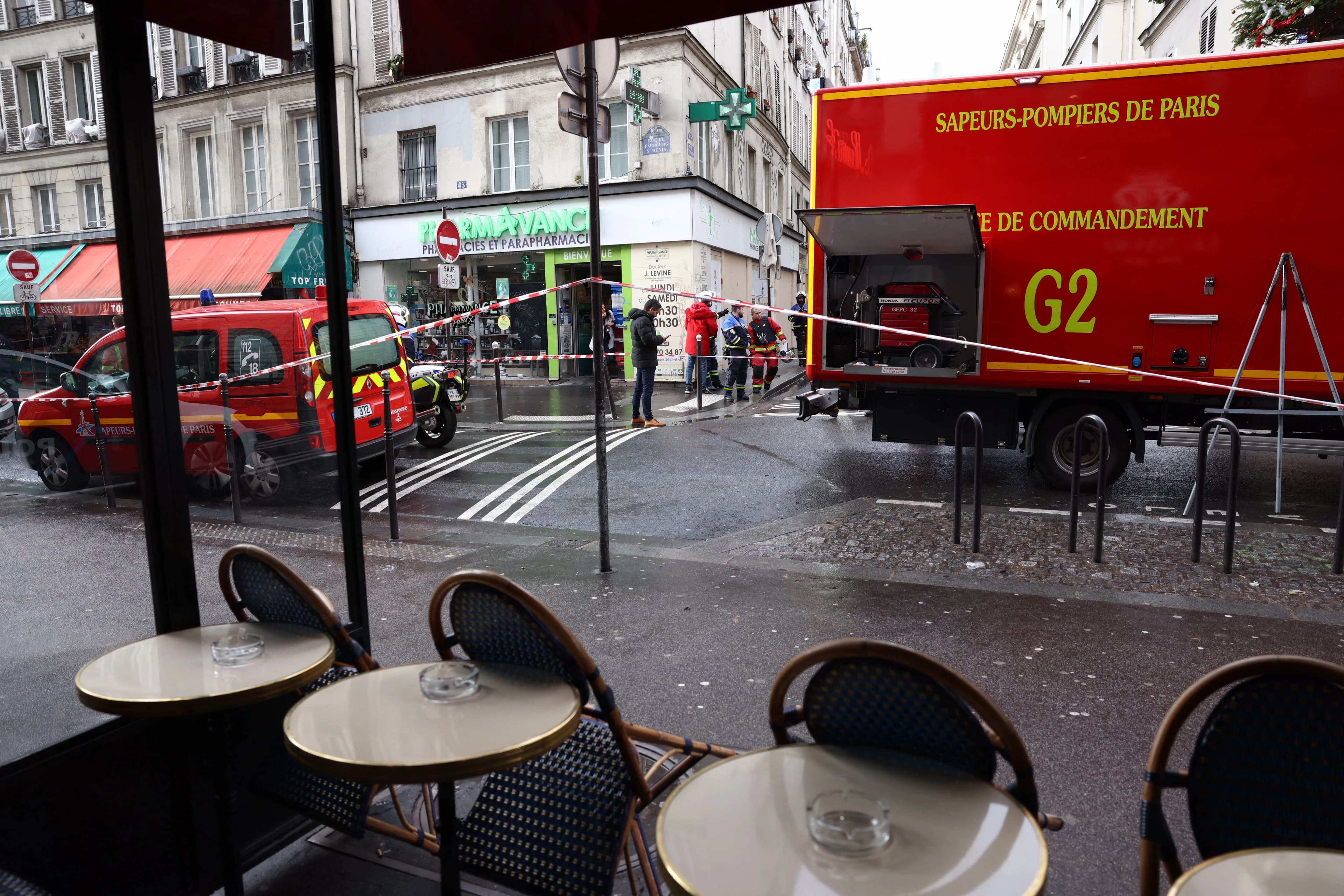 Police tape is used to cordoned off the area following a shooting along rue d'Enghien in the 10th arrondissement, in Paris on December 23, 2022. Photo: AFP