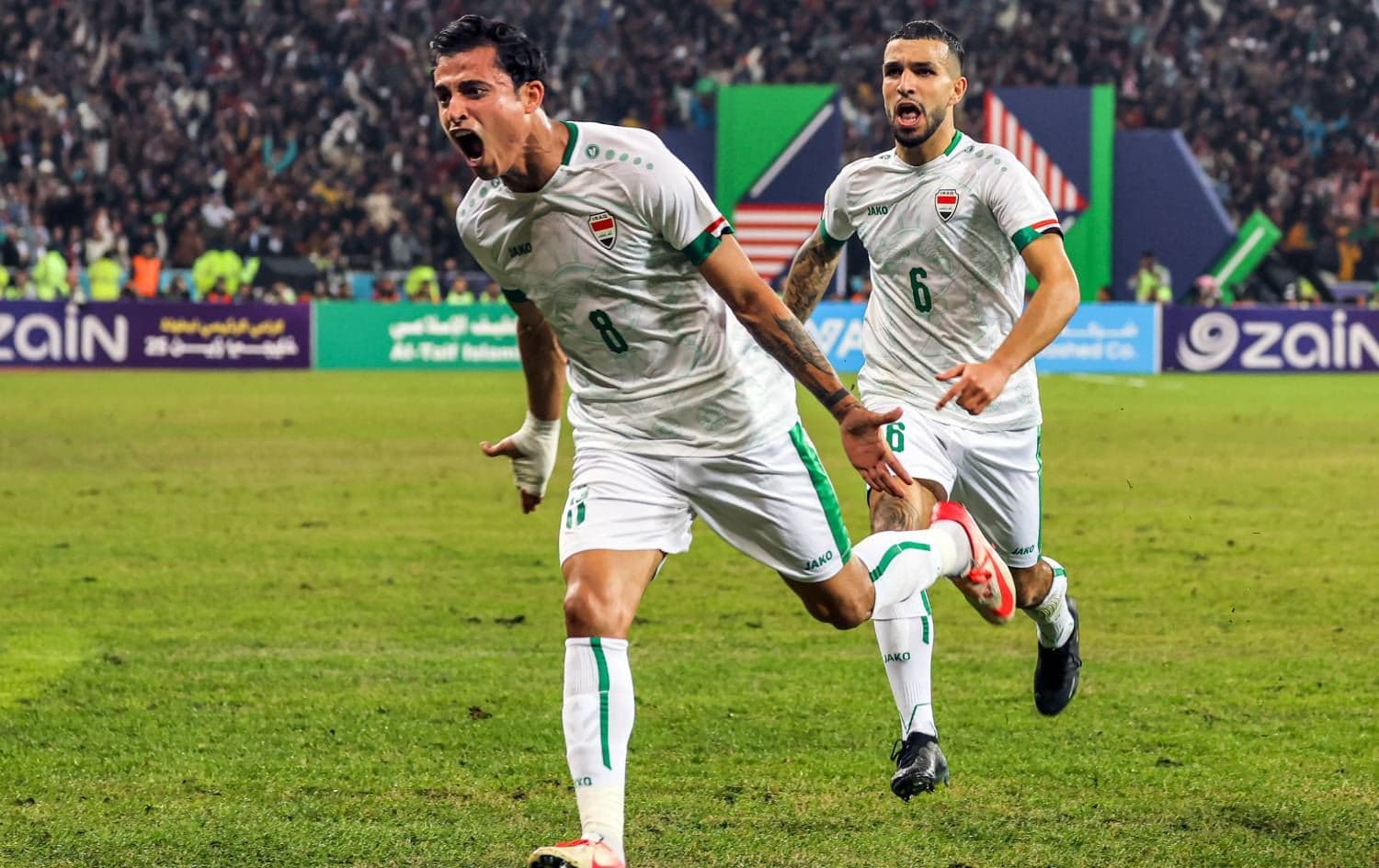 Iraq's midfielder Ibrahim Bayesh (left) reacts after scoring during the 25th Gulf Cup final football match between Iraq and Oman at the Basra International Stadium in Iraq's southern city on January 19, 2023. Photo: Ahmad al-Rubaye/AFP