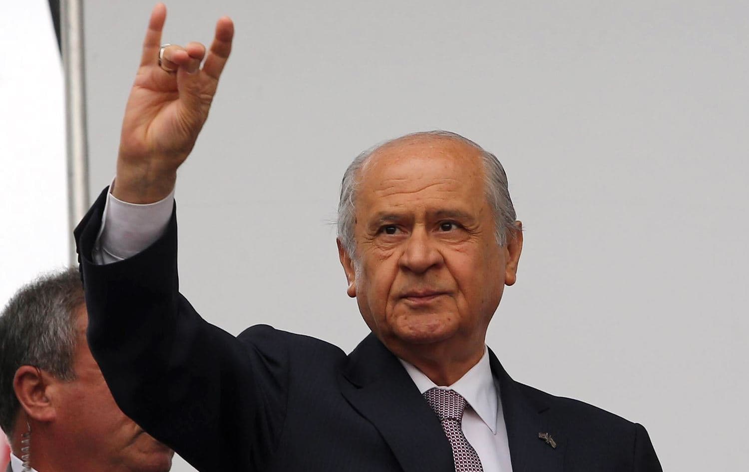 Devlet Bahceli, the leader of Turkey's Nationalist Action Party (MHP) demonstrates a gesture associated with the "Grey Wolves", affiliated with ultranationalist Turks, during an election rally in May, 2020. Photo: AFP
