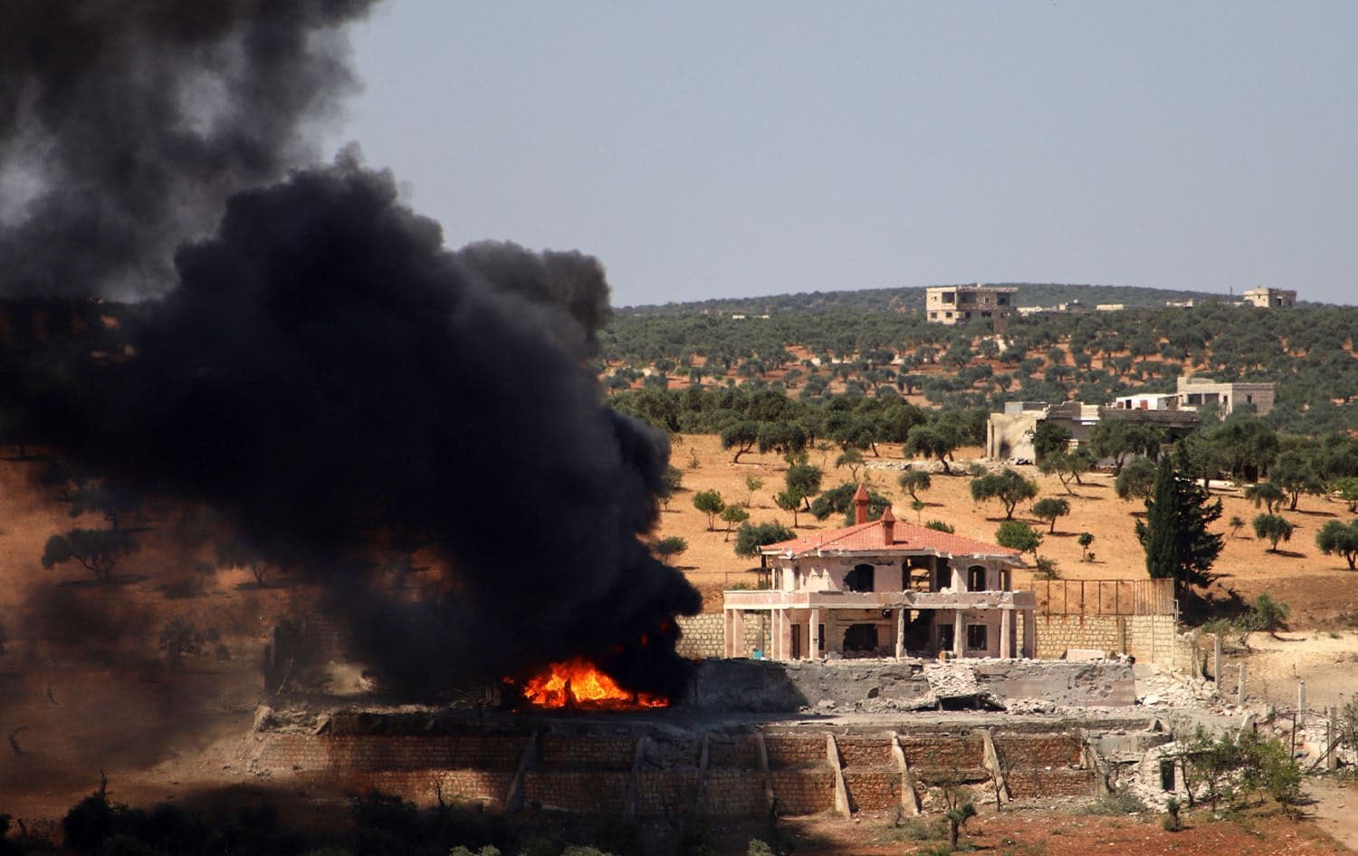 A plume of smoke rises from a building following a reported Russian air strike on Syria's northwestern rebel-held Idlib province, on June 25, 2023. Photo: Abdulaziz Ketaz/AFP