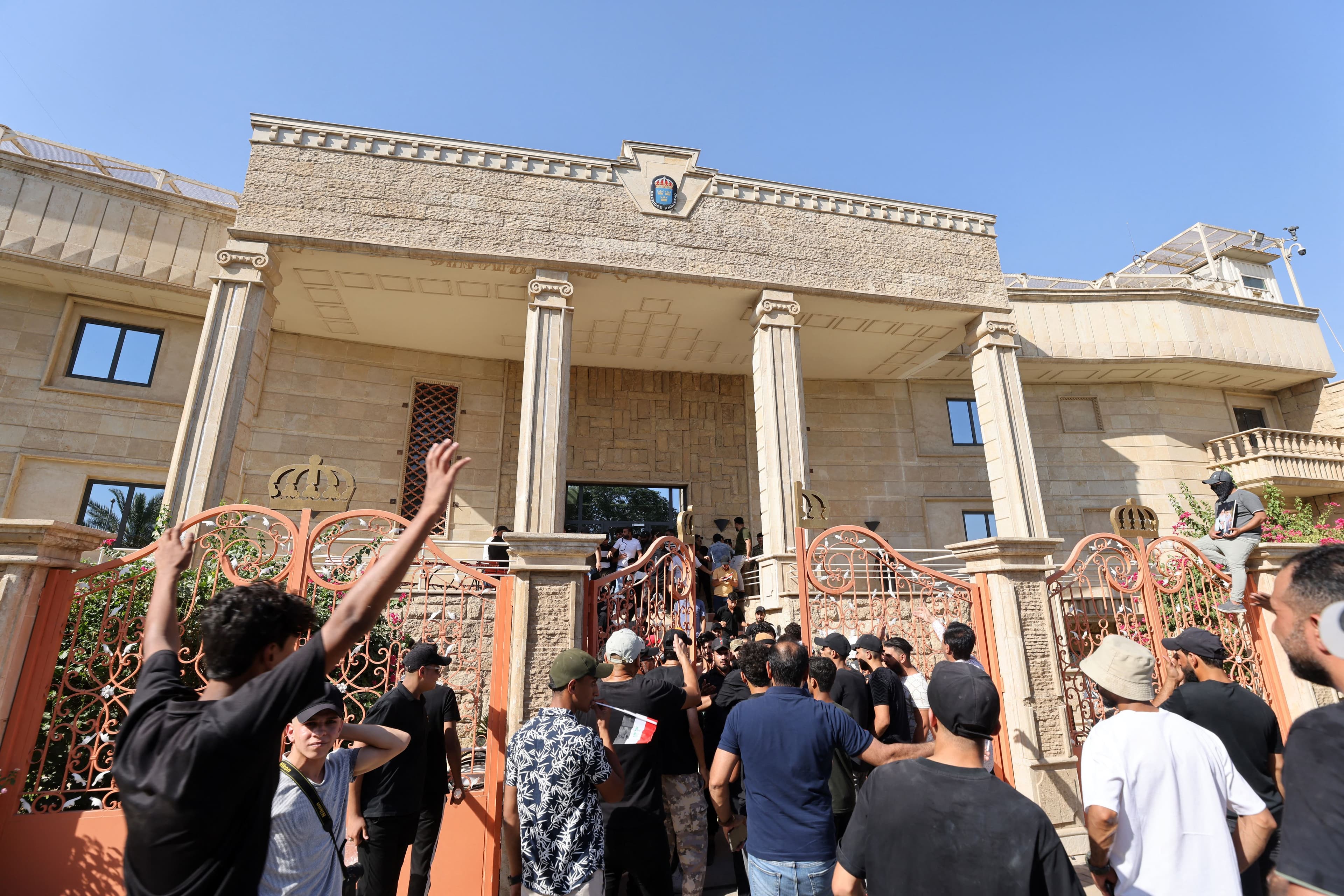 Angry protesters demonstrate inside the courtyard of the Swedish embassy in Baghdad on June 29, 2023. Photo: AFP