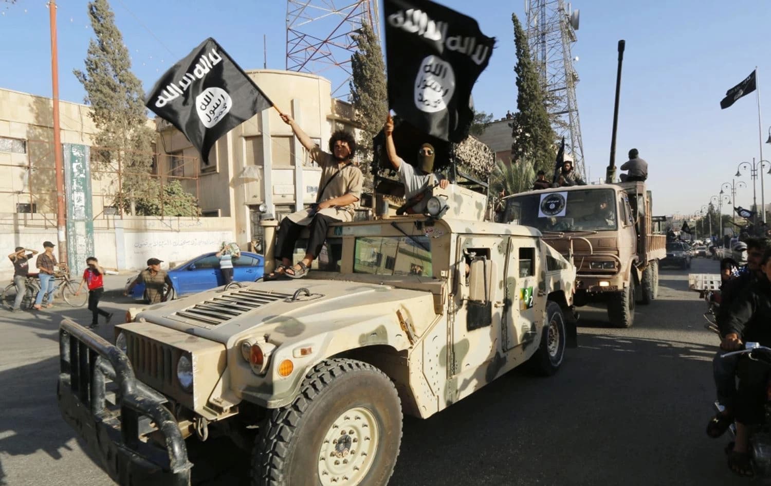 چەند چەکدارێکی داعش لە رەقە لە ساڵی 2014. وێنە: Reuters