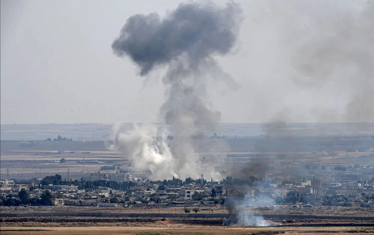 Smoke rise from the Syrian town of Ras al-Ain, following a Turkish attack in 2019. File Photo: AFP