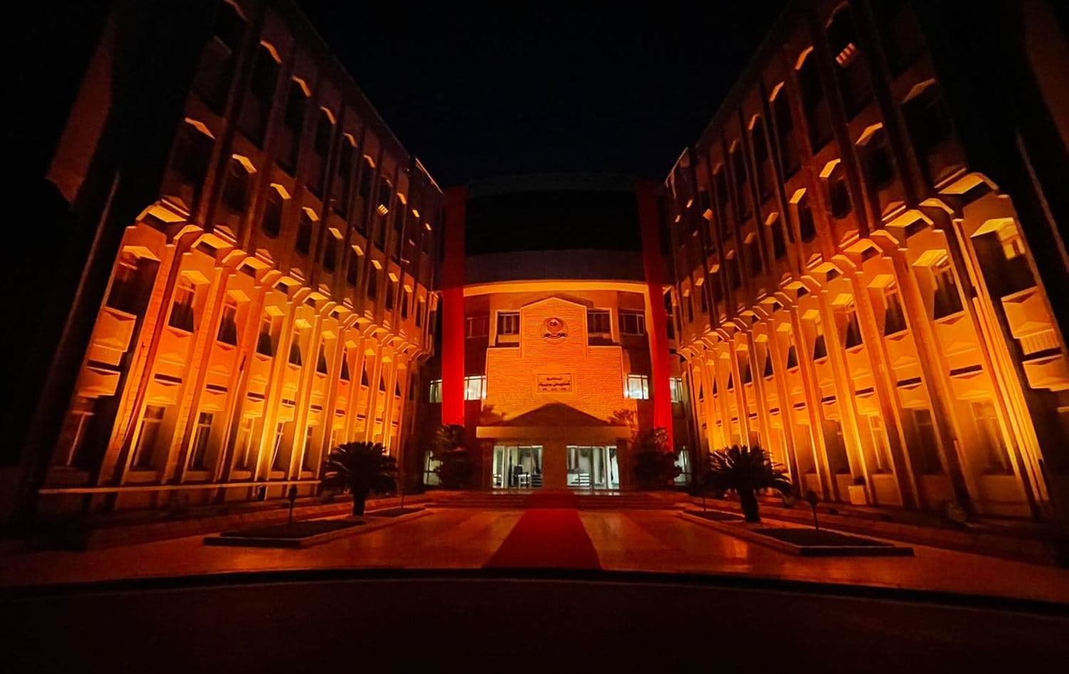 The KRG’s Council of Ministers building flooded in orange light as part of the 16 Days of Activism against gender-based violence campaign on November 26, 2023. Photo: KRG