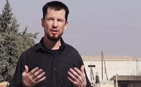 In this image from an undated video published on the Internet by ISIS, captive British journalist John Cantlie speaks into a camera in what he identifies as the embattled Syrian town of Kobani. Photo: AP.