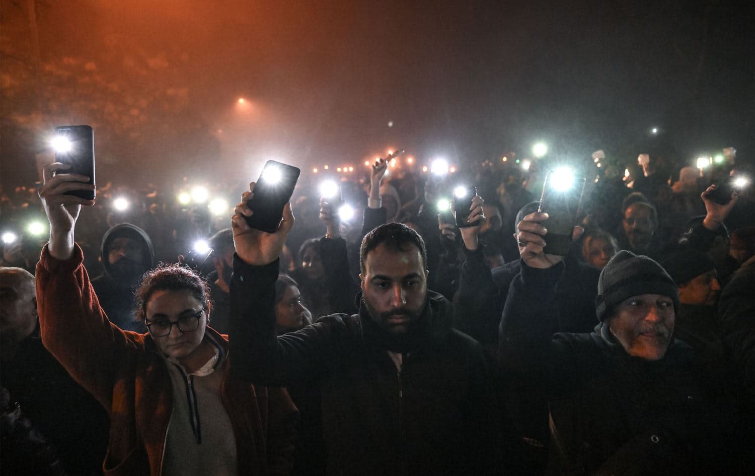 People take part in a vigil to mark the first anniversary of the earthquake, in Antakya on February 6, 2024. Photo: Ozan Kose/AFP