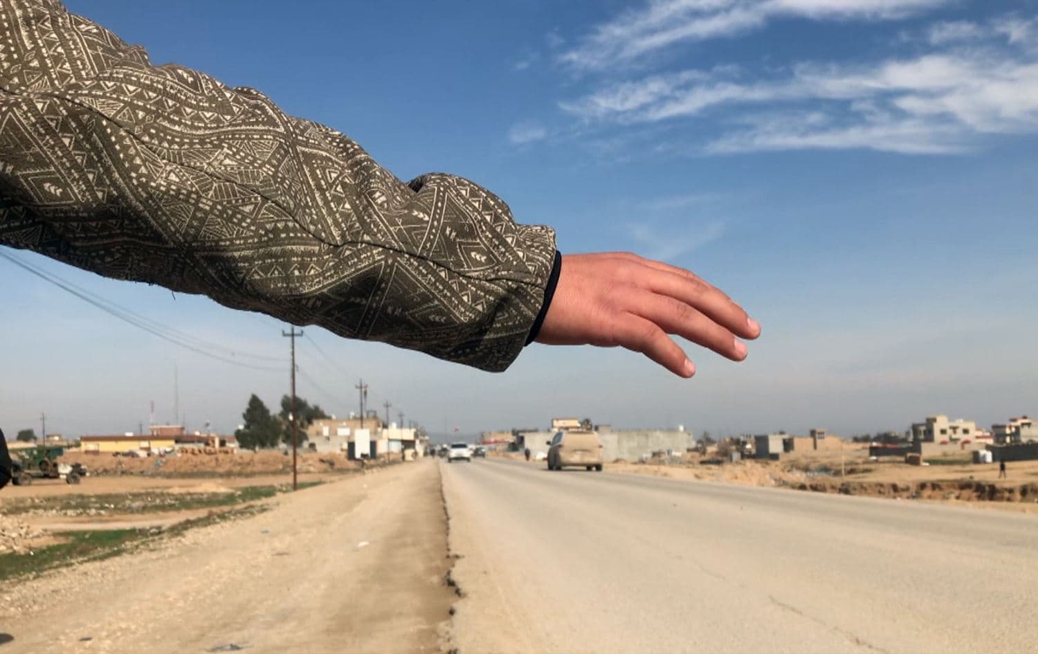 Child in Shingal attempts hitchhike to school. Photo: Rudaw screengrab