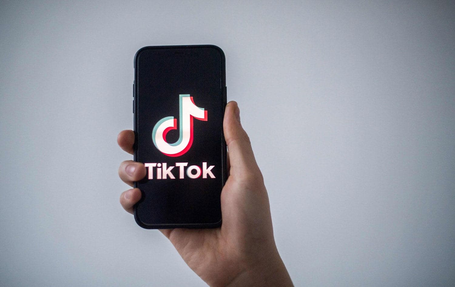 A man shows a smartphone with the logo of Chinese social network TikTok in this file illustration photo taken in Nantes, western France on January 21, 2021. Photo: AFP