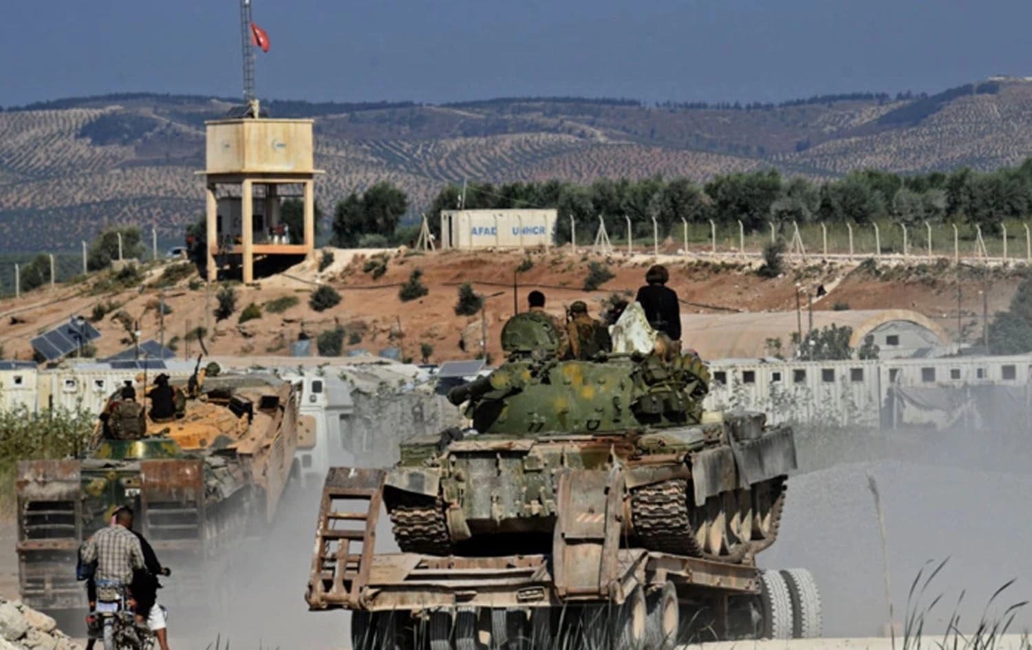 Members of the Hayat Tahrir al-Sham (HTS) jihadist group bring reinforcements on the outskirts of the Afrin region of Syria's rebel-held northern Aleppo province, on October 13, 2022. Photo: AFP