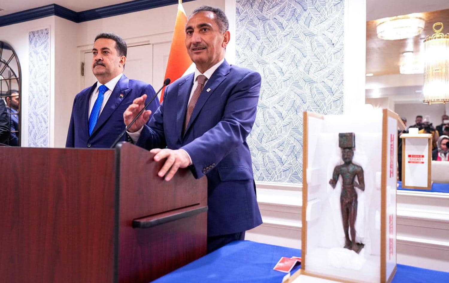 Iraq's Ambassador to Washington Nazar al-Khairullah (right) delivers a speech next to Iraqi Prime Minister Mohammed Shia' al-Sudani (left) after recovering an ancient Sumerian artifact, seen on the right, in Washington on April 16, 2024. Photo: PM Sudani's office