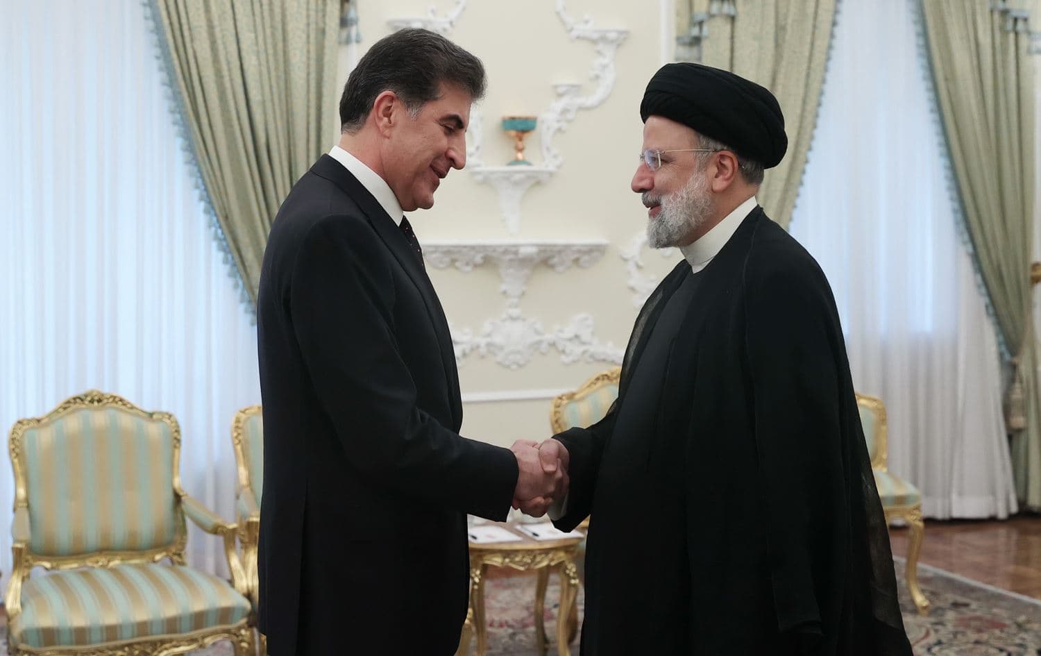 Kurdistan Region President Nechirvan Barzani (left) shakes hands with Iranian President Ebrahim Raisi in Tehran on May 6, 2024. Photo: Raisi's office