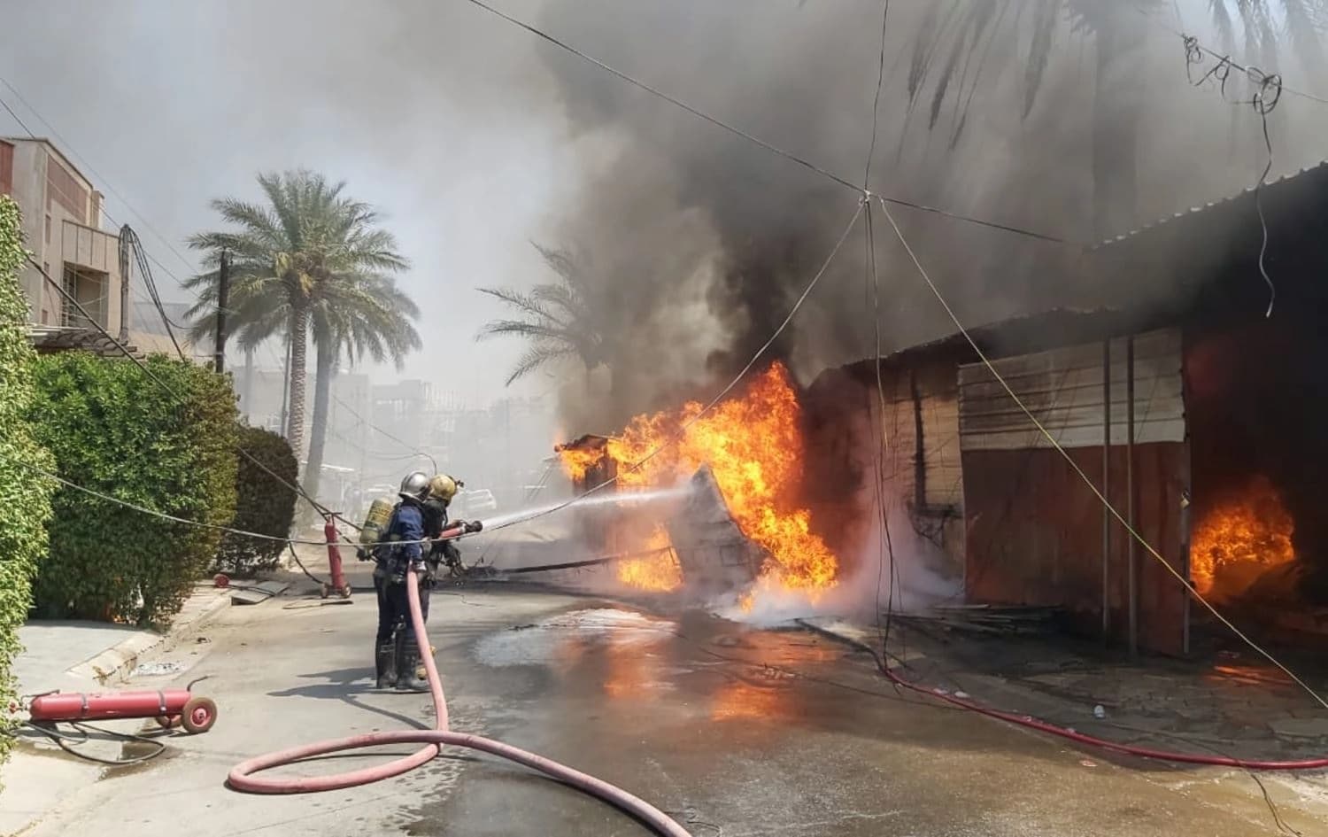 دیمەنێکی ئاگرکوژاندنەوە لە عێراق