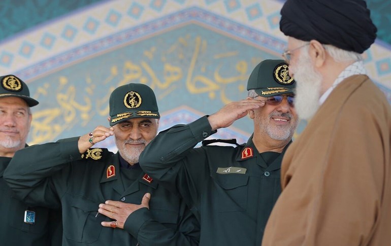 Gen. Qasem Soleimani (2nd from left) salutes as Ayatollah Ali Khamenei walks past. File photo: IRNA
