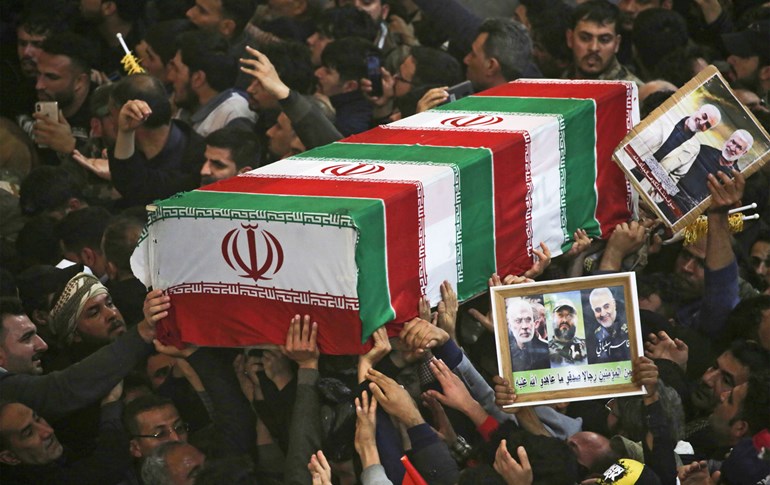 Mourners carry the coffins of slain Iraqi paramilitary chief Abu Mahdi al-Muhandis, Iranian military commander Qasem Soleimani and eight others inside the Shrine of Imam Hussein in the holy Iraqi city of Karbala on January 4, 2020. Photo: Mohammed Sawaf/AFP