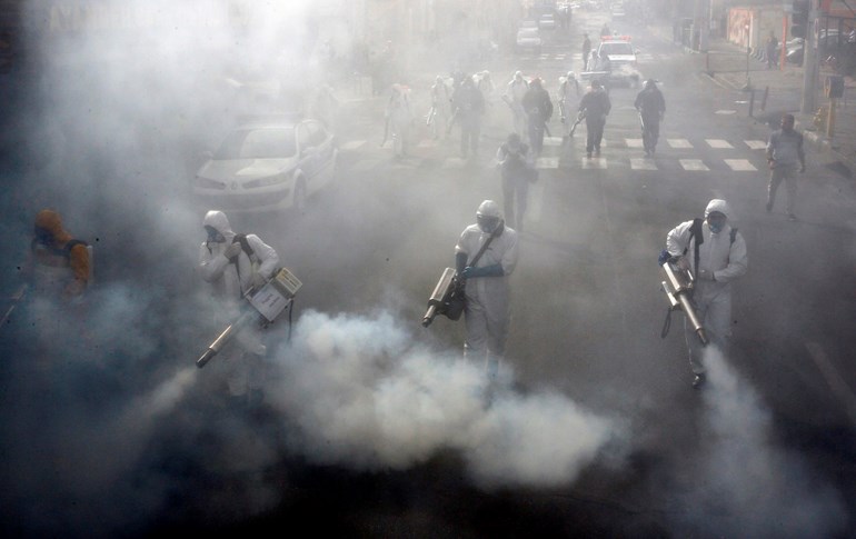 Iranian firefighters disinfect streets in the capital Tehran. Photo: AFP 