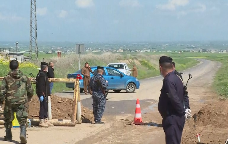 Security forces guard the entrance to the quarantined Erbil settlement of Sebiran, March 31, 2020. Photo: Rudaw TV