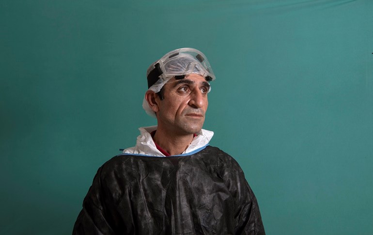 Mehmet Sakirsahsi, a registered cleaning staff worker who has been part of the COVID-19 disinfection service, poses during a photo session at the Istanbul University Cerrahpasa medical faculty Hospital in Istanbul on April 6, 2020. Photo: Ozan Kose / AFP