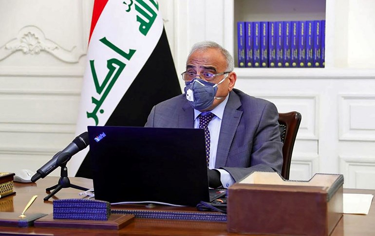 Iraq's caretaker prime minister Adil Abdul-Mahdi chairs a meeting in Baghdad on April 8, 2020. Photo: Iraqi Prime Minister's Office / AFP