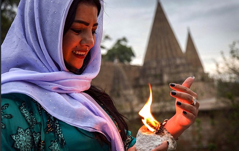 A Yezidi woman celebrates New Year at Lalish on April 17, 2019. Photo: Safin Hamed/AFP