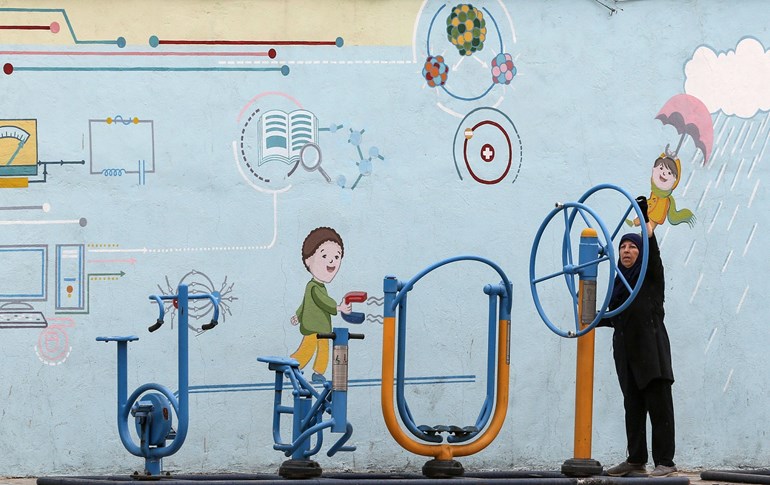 An Iranian woman exercises in a public outdoor gym in the capital Tehran, on April 26, 2020. Photo: Atta Kenare/AFP