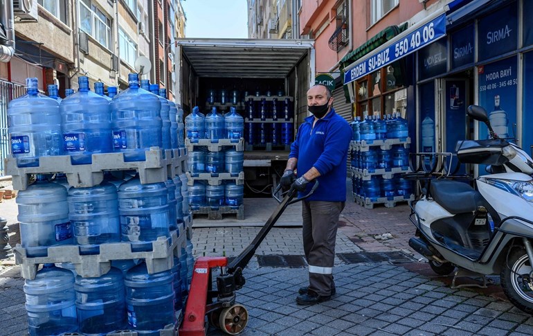 A water distribution company employee poses for a picture at Kadikoy in Istanbul, on April 18, 2020. Photo: Bulent Kilic/AFP