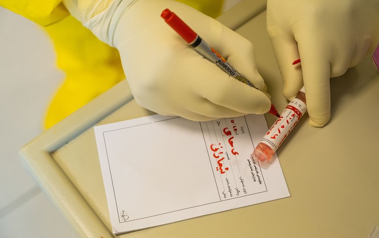 A health worker logs a COVID-19 testing sample, which Erbil's Deputy Governor Hemin Qadir told Rudaw costs $100. Photo: Bilind T. Abdullah