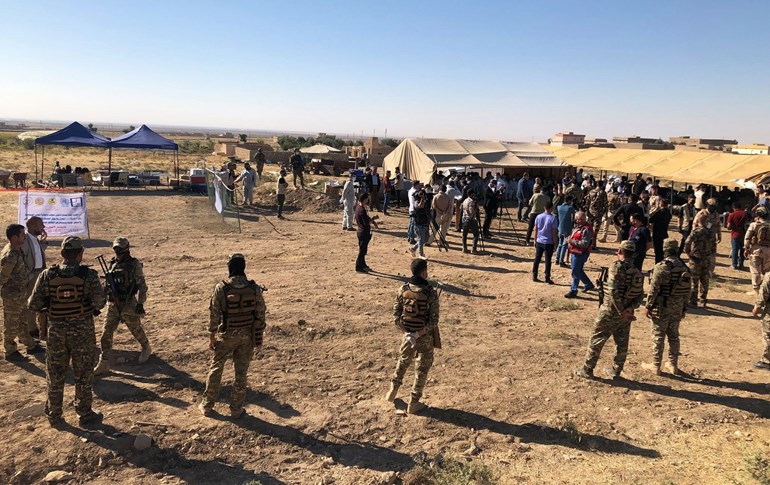 Media and security pictured in Solagh, Shingal region on Saturday morning ahead of a ceremony to mark exhumation of a mass grave of ISIS victims. Photo: Fazel Hawramy/Rudaw