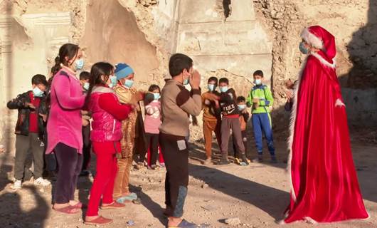 Mother Christmas gifts joy to Mosul's children