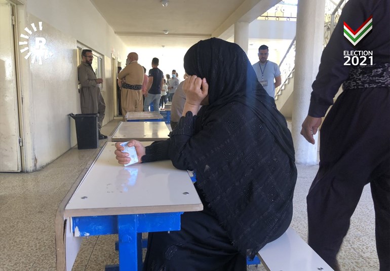 Locals wait to cast their vote as the polling station at the Zhelwan school in Erbil experienced technical issues. Photo: Rudaw