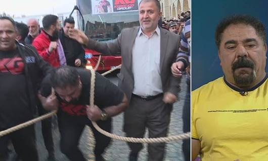 Kürt sporcu 42 tonluk otobüsü halatla çekti