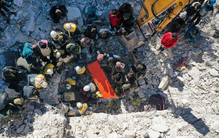 An aerial picture shows rescuers searching the rubble of buildings for casualties and survivors in the village of Salqin in Syria's rebel-held northwestern Idlib province at the border with Turkey following an earthquake, on February 7, 2023. Photo: Omar Haj Kadour/AFP