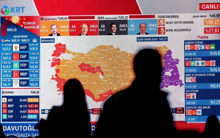 CHP members watch TV after the first results at the CHP building in Istanbul on May 14, 2023. Photo: Yasin Akgul/AFP