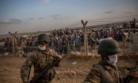 Xelkê li ser sînorê Bakur û Rojavayê Kurdistanê / Wêne: Bryan Denton/The New York Times/Arşîv