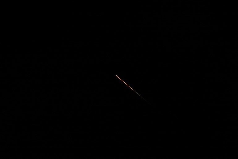 Intercepted missiles that were fired from Iran towards Israel, as seen over northern Israel. Photo: Jalaa Marey / AFP