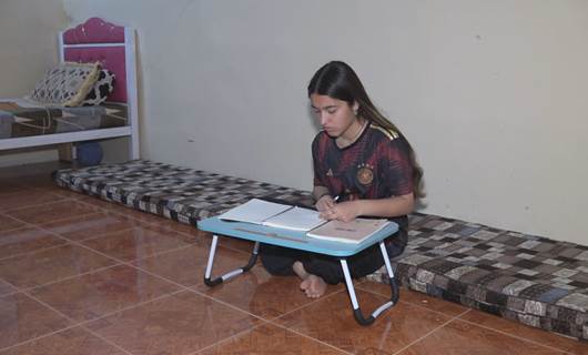 Once held captive by ISIS, Yazidi teen now top of her class