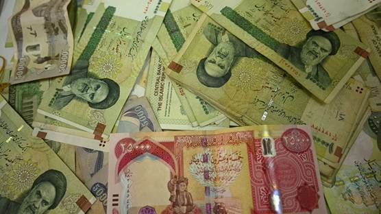 Iraqi and Iranian banknotes. Photo: Bilind T. Abdullah/Rudaw