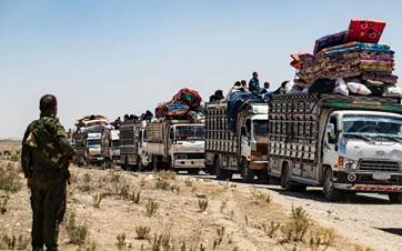 ISIS-affiliated families leaving al-Hol camp in Syria's Hasaka. File photo: AFP