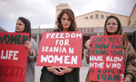 Women take part in a rally in support of Iranian women in Pristina. Photo: AFP