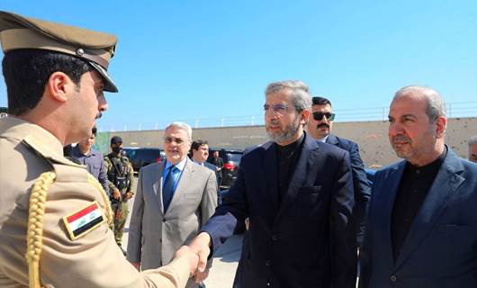 Iran’s acting foreign minister Ali Bagheri Kani (center) shakes hand with an Iraqi soldier at the memorial site of Soleimani and Muhandis near Baghdad airport on June 13, 2024. Photo: Mehr News Agency