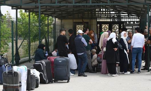 Ülkesine dönen Suriyeliler